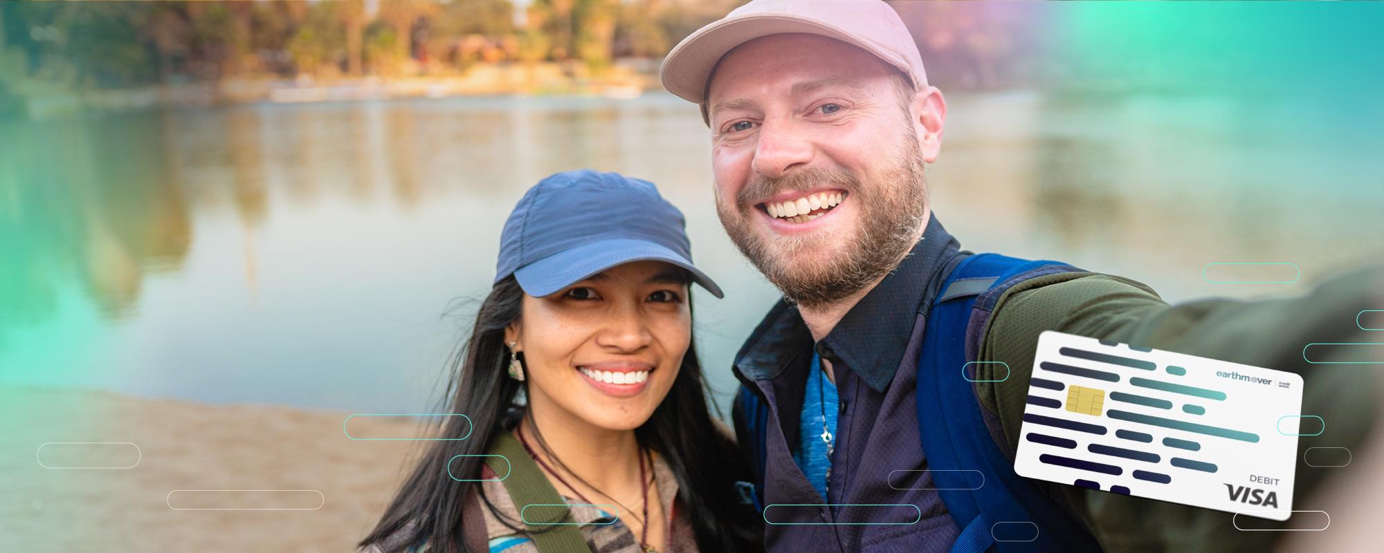 Man and woman in front of lake